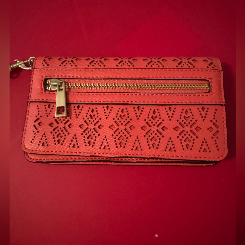 Like new coral punch out wristlet wallet